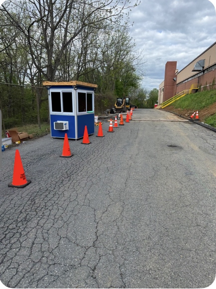 Coned-off work zone and site office at a commercial tenant improvement project in Allentown, PA