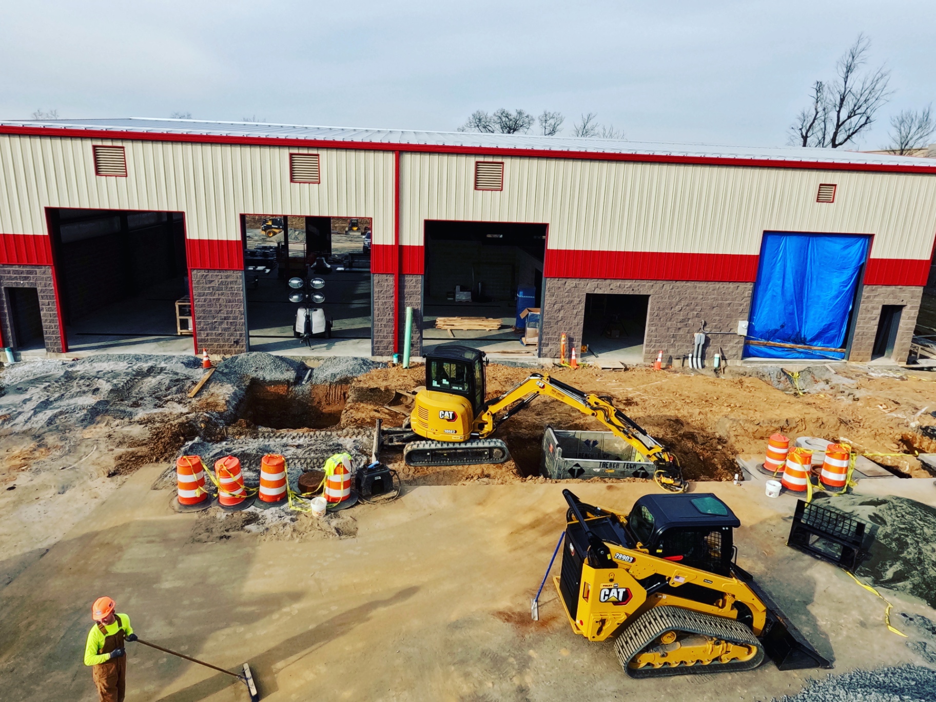WoodEx excavation and utility trench work at a commercial job site