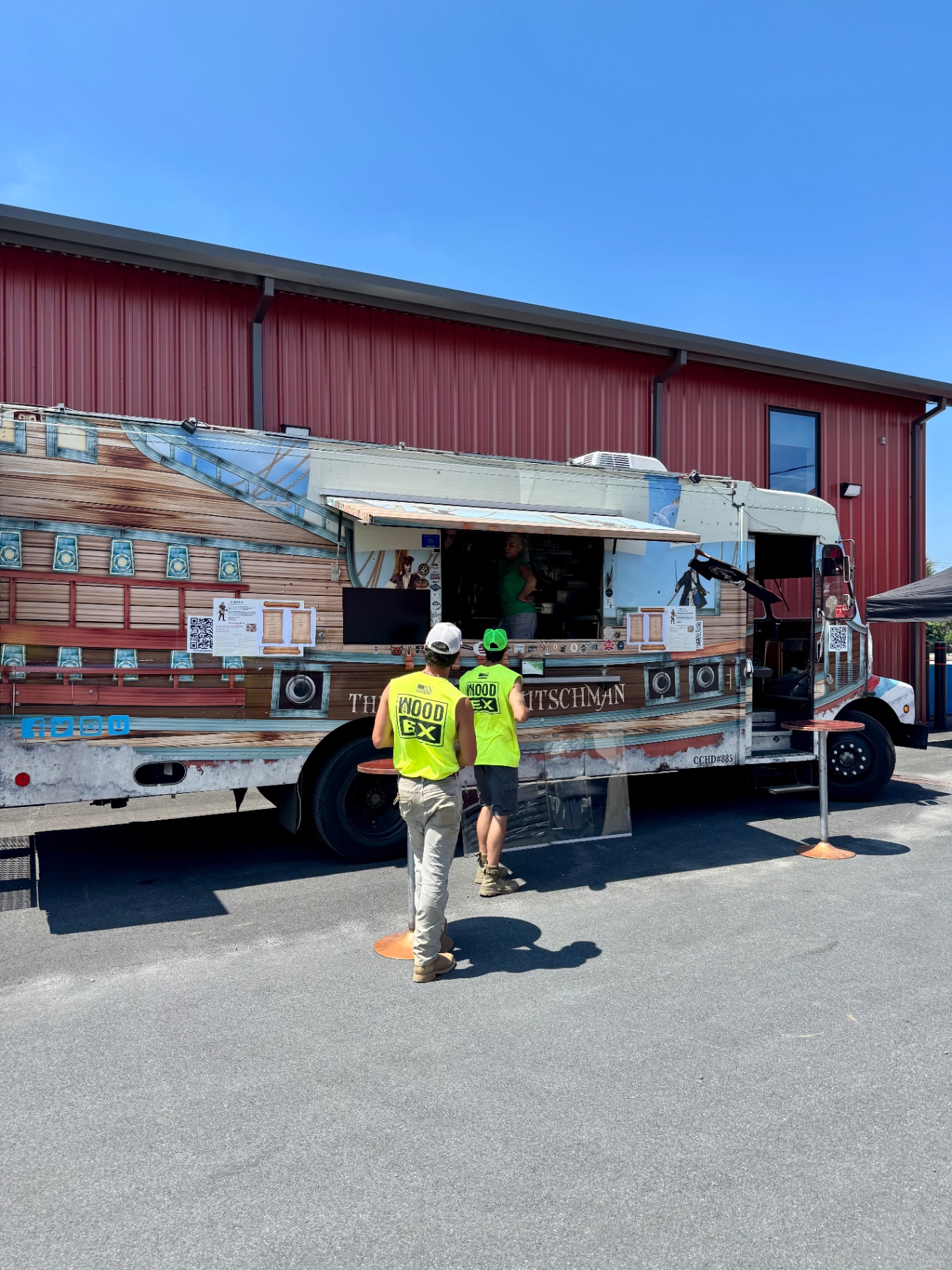 WoodEx crew members grabbing lunch at a food truck